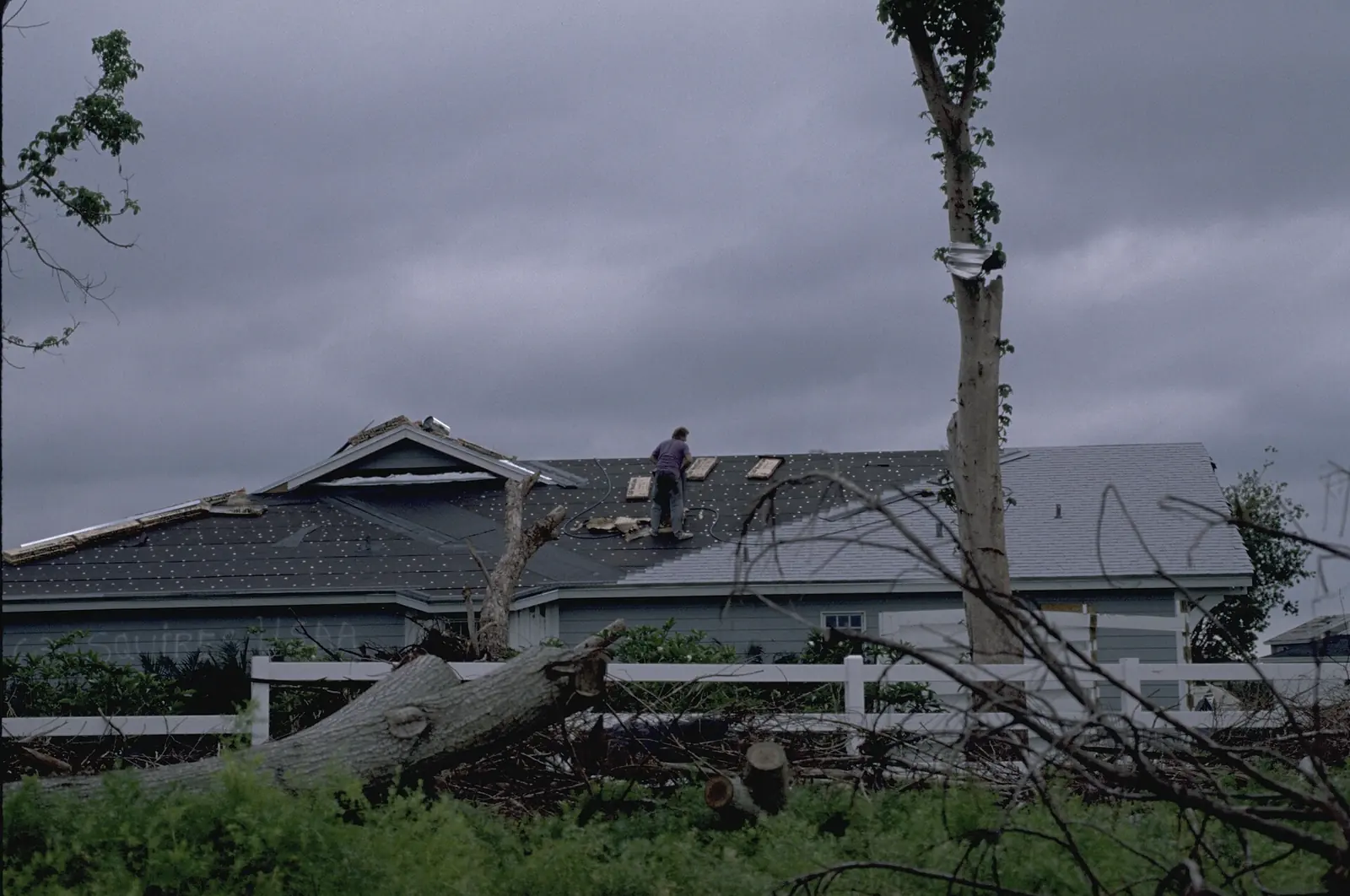 A storm-damaged roof, in natural color